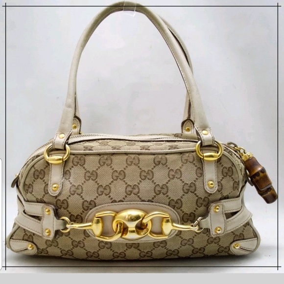 Gucci Handbags - RARE AUTH GUCCI BOSTON MONOGRM BAG W/BAMBOO/GOLD